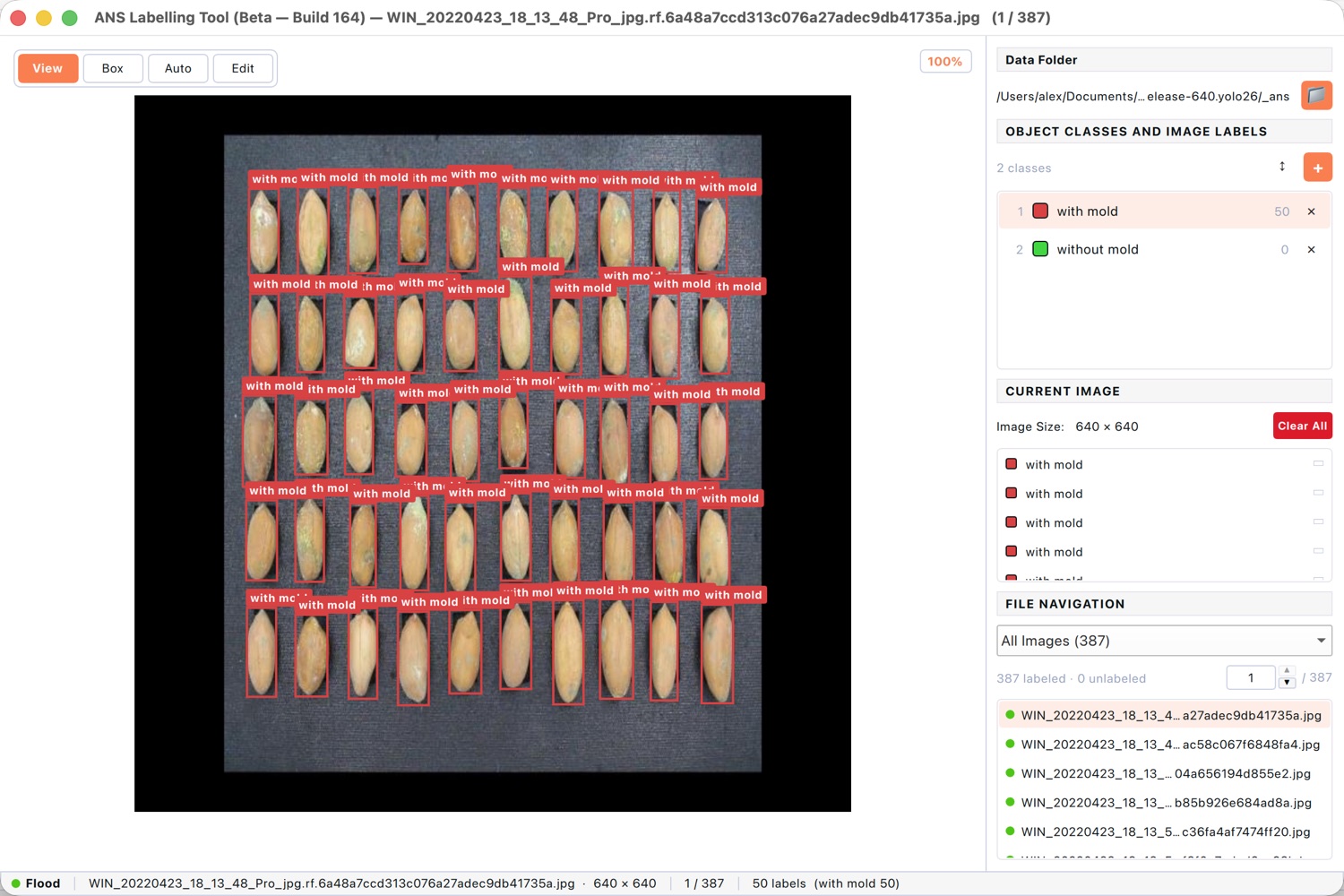 Labelling tool with bounding boxes around every peanut, each tagged with a quality class.